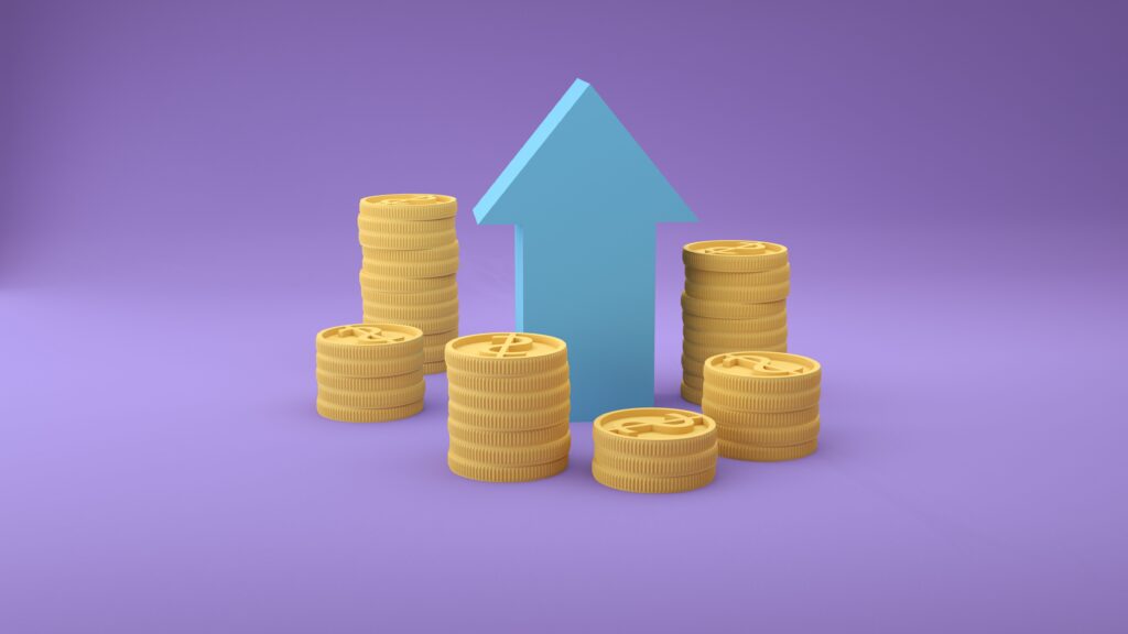 Stacks of coins with an upward arrow symbolizing financial growth and success.